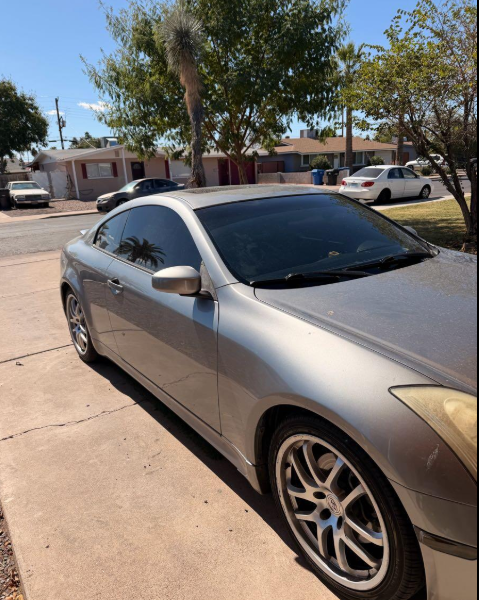 Silver coupe with dark window tint